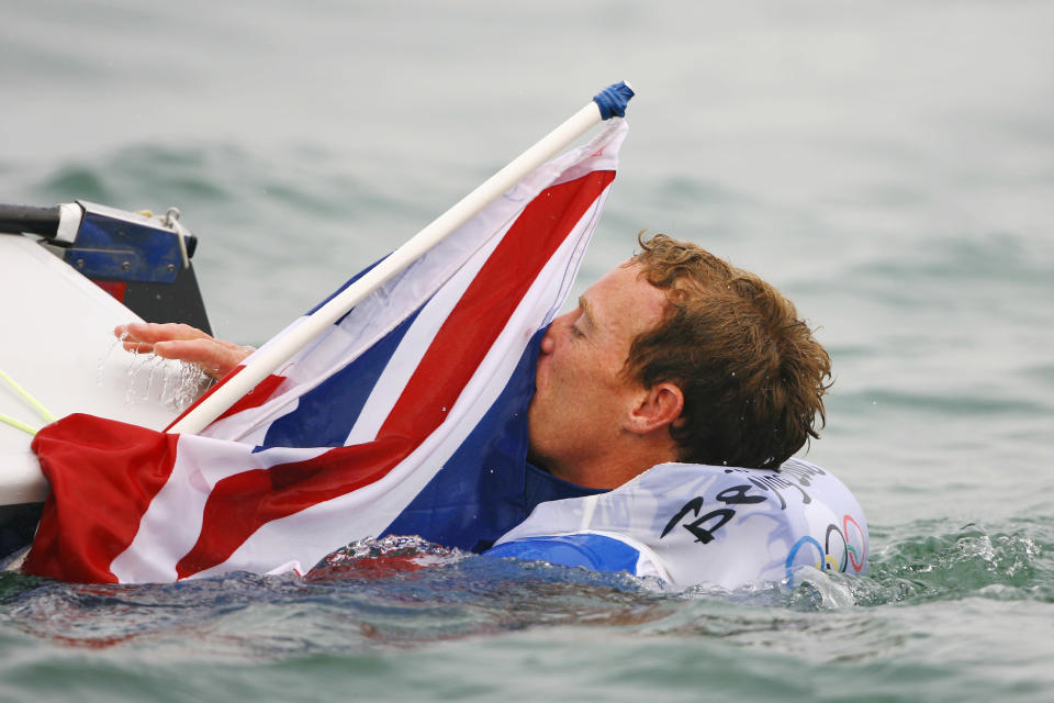 QINGDAO, CHINA - AUGUST 19: Paul Goodison of Great Britain celebrates overall victory in the Laser class event following the medal race held at the Qingdao Olympic Sailing Center during day 11 of the Beijing 2008 Olympic Games on August 19, 2008 in Qingdao, China. (Photo by Clive Mason/Getty Images)