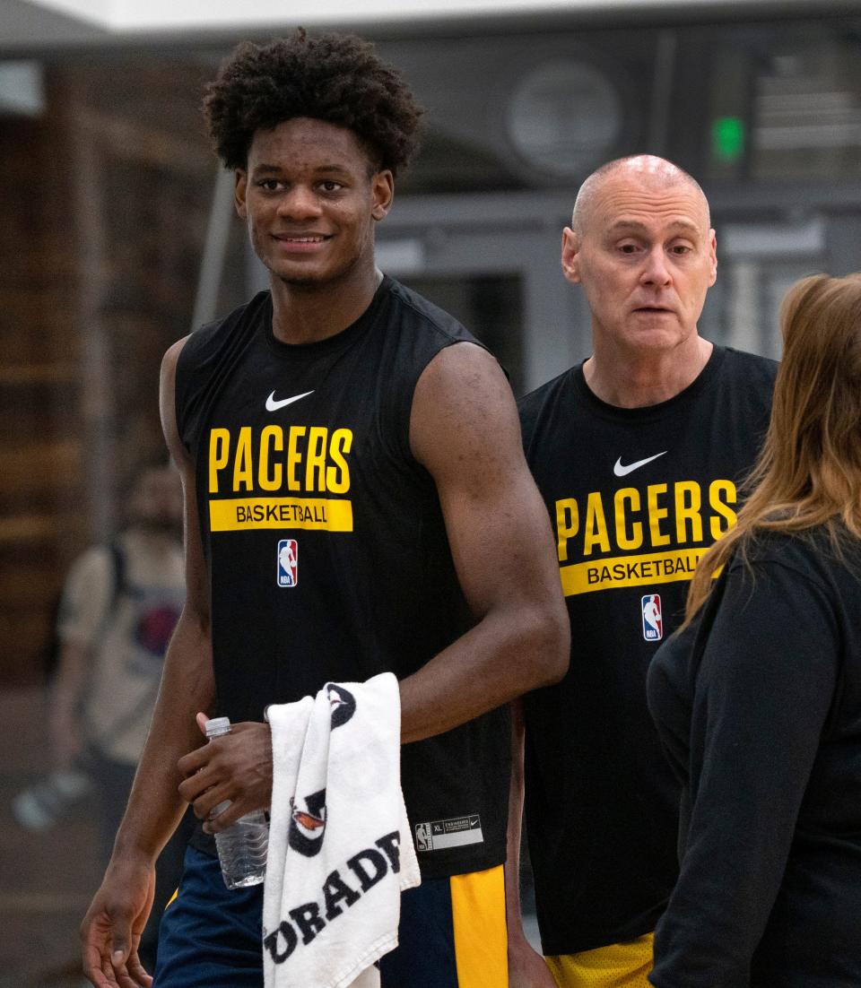 Taylor Hendricks, left, goes to speak with the press after his Indiana Pacers 2023 Pre-Draft Workout, Wednesday, June 7, 2023 at the Ascension St. Vincent Center. Indiana Pacers Head Coach Rick Carlisle, right, stands behind him.