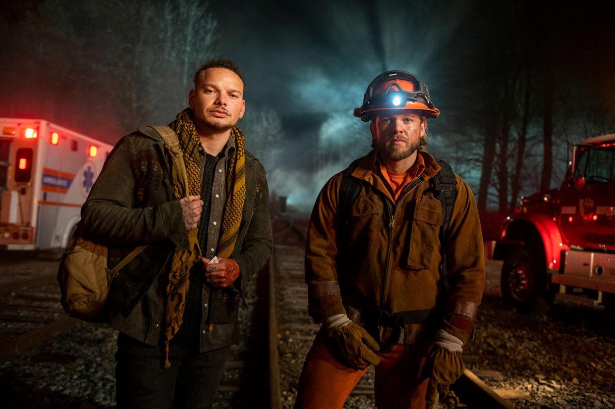 “Off the Rails” – The crews respond to the scene of a train crash where the rescue has the potential to spiral out of control when they discover the train is full of illicit cargo, and multi-platinum entertainer Kane Brown makes his acting debut as Robin, an enigmatic, modern-day train hopper who helps injured patients, on FIRE COUNTRY, Friday, April 7 (9:00 – 10:00 PM, ET/PT) on the CBS Television Network and available to stream live and on demand on Paramount+*.  Pictured (L-R): Kane Brown and Max Thieriot.  Photo: Sergei Bachlakov/CBS ©2023 CBS Broadcasting, Inc. All Rights Reserved.