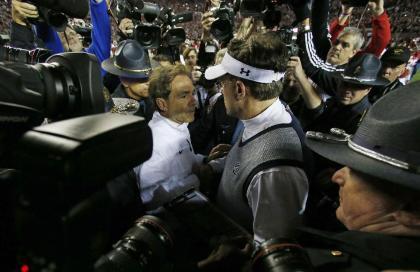 Alabama's Nick Saban (L) speaks with Auburn's Gus Malzahn after the 2014 Iron Bowl. (AP)