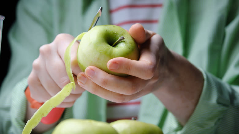apple being peeled