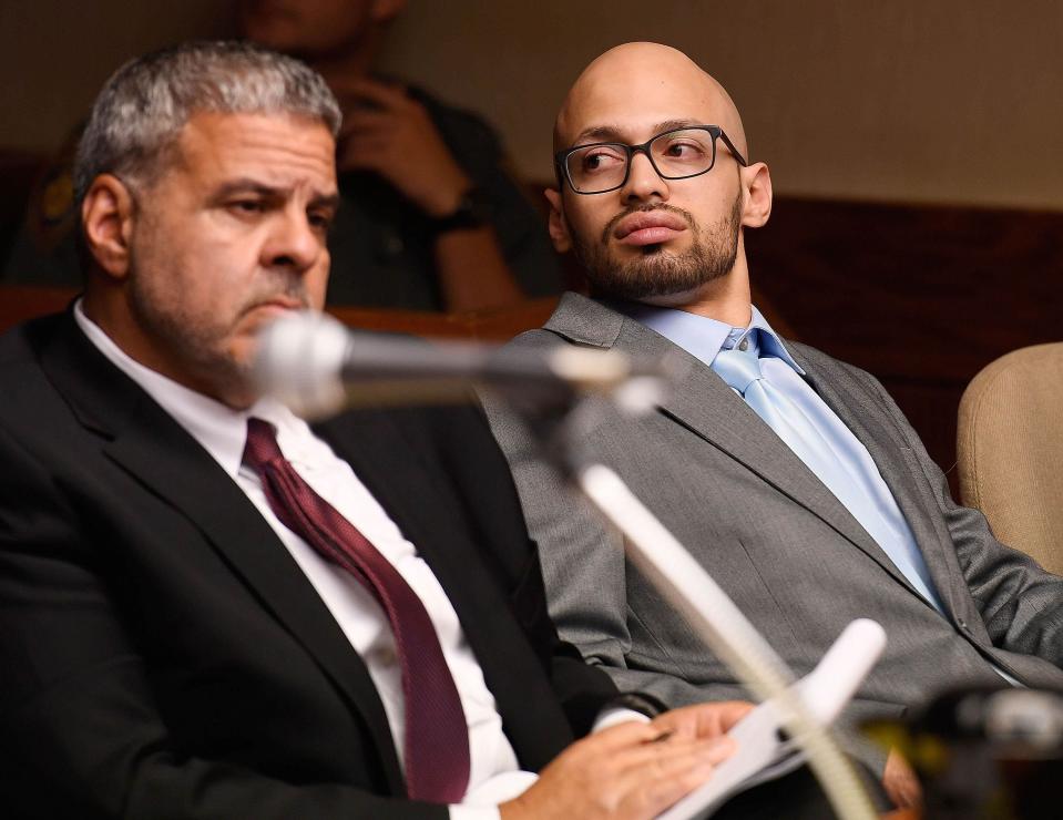 Sergio Correa, right, sits with defense attorney Joseph E. Lopez Sr., left, in this file photo.