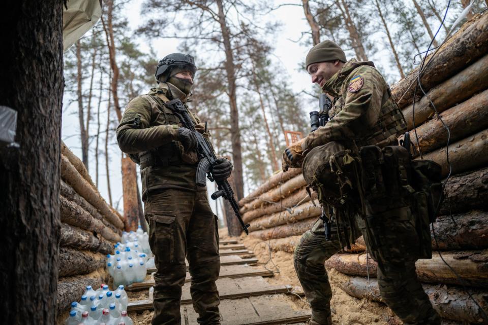 Ukraine’s 95th Air Assault Brigade troops share a light moment in Kreminna. The city is located on the western edge of the Luhansk region, and has seen fierce fighting between Ukraine and the Russian forces who occupy it (Getty Images)