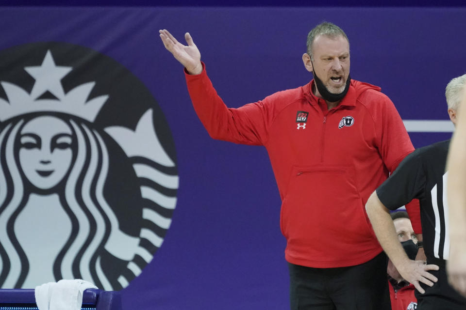 Utah head coach Larry Krystkowiak gestures near the bench during the first half of an NCAA college basketball game against Washington, Sunday, Jan. 24, 2021, in Seattle. (AP Photo/Ted S. Warren)
