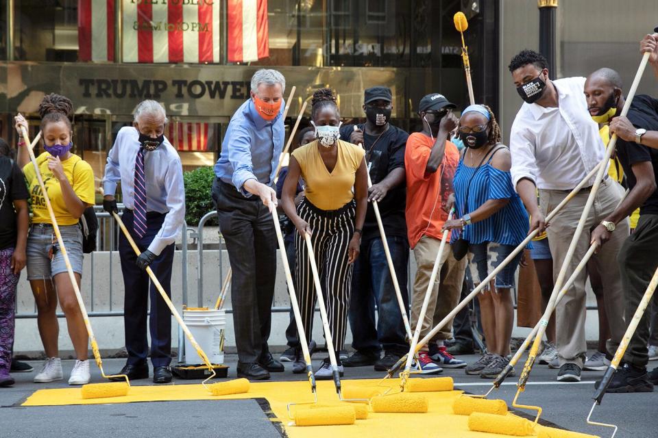 Black Lives Matter is painted on Fifth Avenue in front of Trump Tower, in New York