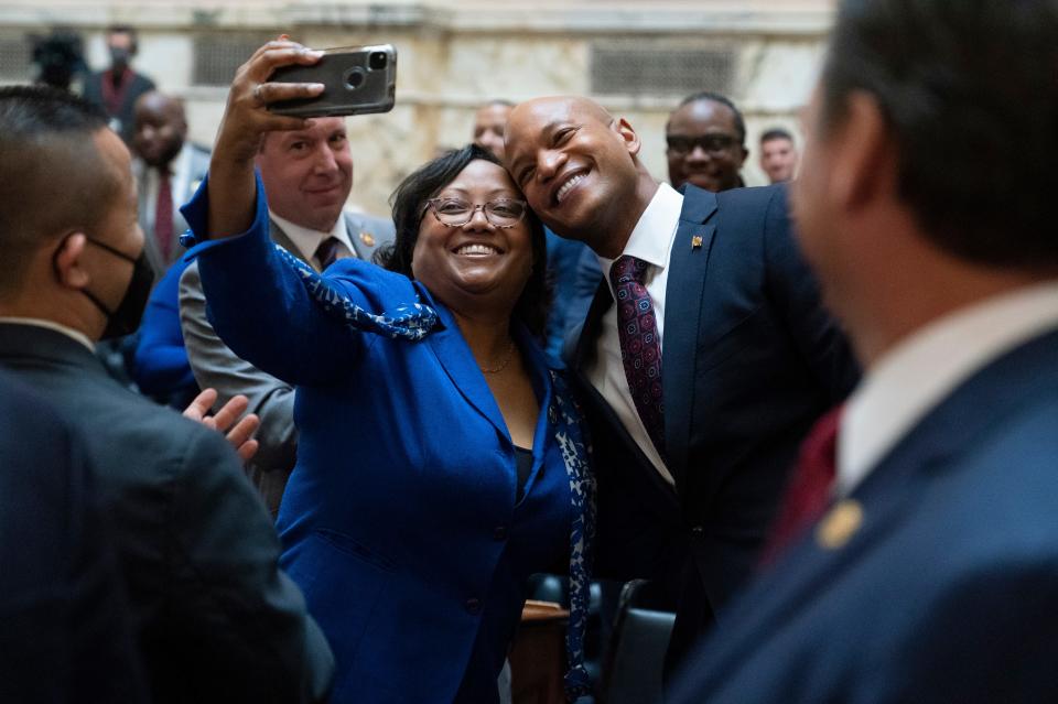 In this file photo, Maryland Gov. Wes Moore, center right, poses for a selfie with Delegate Sheree Sample-Hughes, D-Dorchester and Wicomico counties, while arriving to deliver his first state of the state address, two weeks after being sworn as governor, Wednesday, Feb. 1, 2023, in Annapolis, Md.
