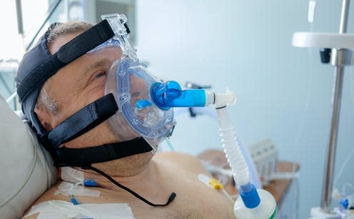 <span class="caption">A man wearing a continuous positive airway pressure mask – one of the techniques preferred over using a mechanical ventilator. </span> <span class="attribution"><a class="link " href="https://www.shutterstock.com/image-photo/20180531-belarus-grodno-regional-cardiac-centre-1117584728" rel="nofollow noopener" target="_blank" data-ylk="slk:Kiryl Lis/Shutterstock;elm:context_link;itc:0;sec:content-canvas">Kiryl Lis/Shutterstock</a></span>