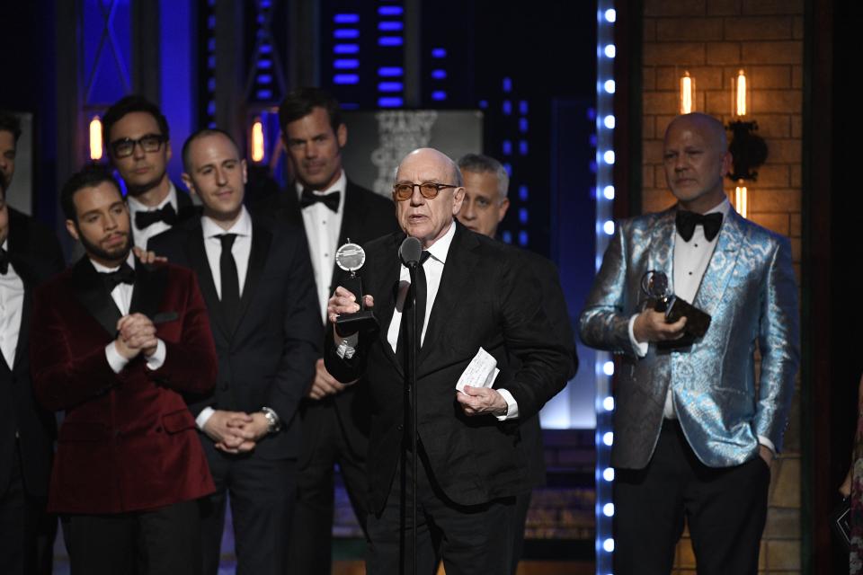 "The Boys in the Band" playwright Mart Crowley accepts the Tony Award for best revival of a play, along with producer Ryan Murphy, right, and cast members in 2019.