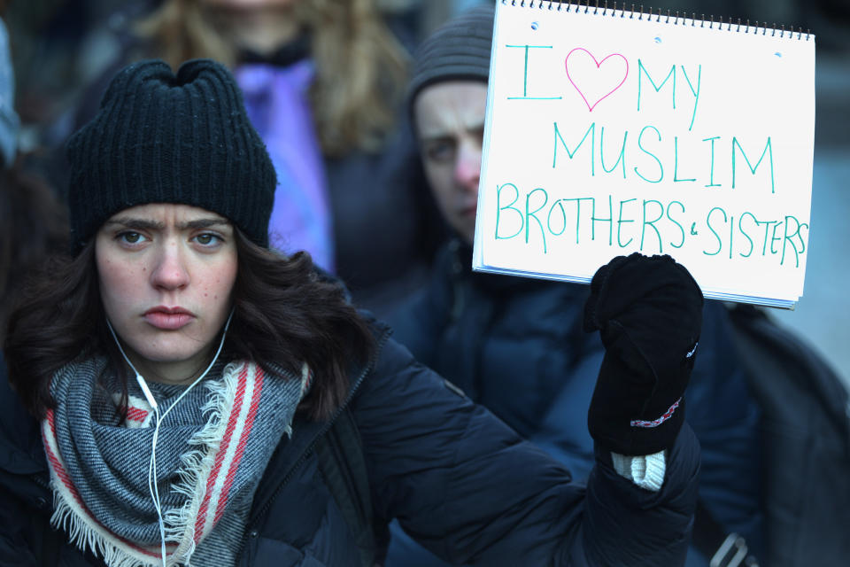 Woman holding a sign saying 'I love my Muslim brothers and sisters' during a massive protest against President Trump's travel ban outside of the U.S. Consulate in downtown Toronto, Ontario, Canada, on Jan. 30, 2017. Canadians joined countries around the world in protesting against President Donald Trump's executive order, banning citizens of seven majority-Muslim countries (Iran, Iraq, Sudan, Somalia, Syria, Yemen and Libya) from entering the United States for the next three months and banning Syrian refugees from indefinitely entering America.