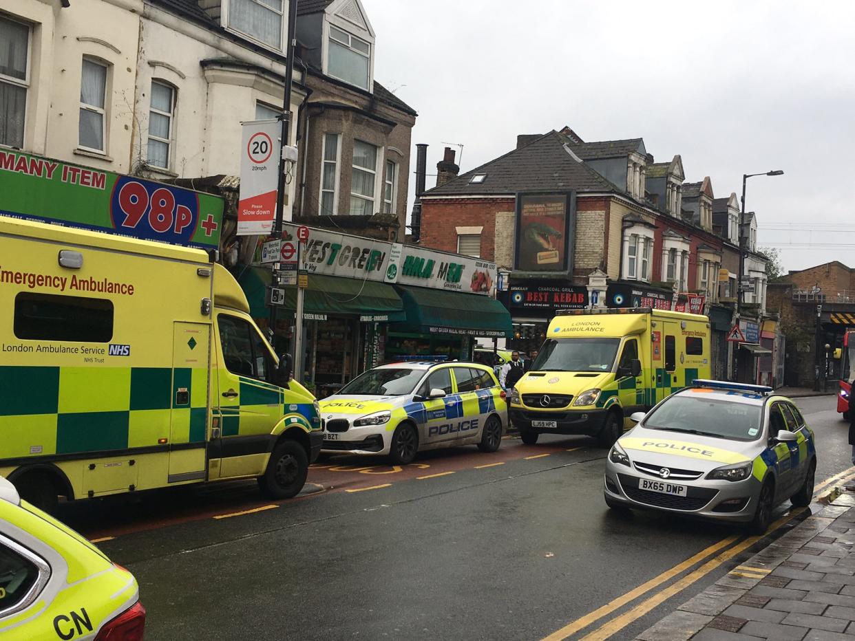 Police outside the butcher's shop on Sunday morning. (Twitter/@fumingchu)