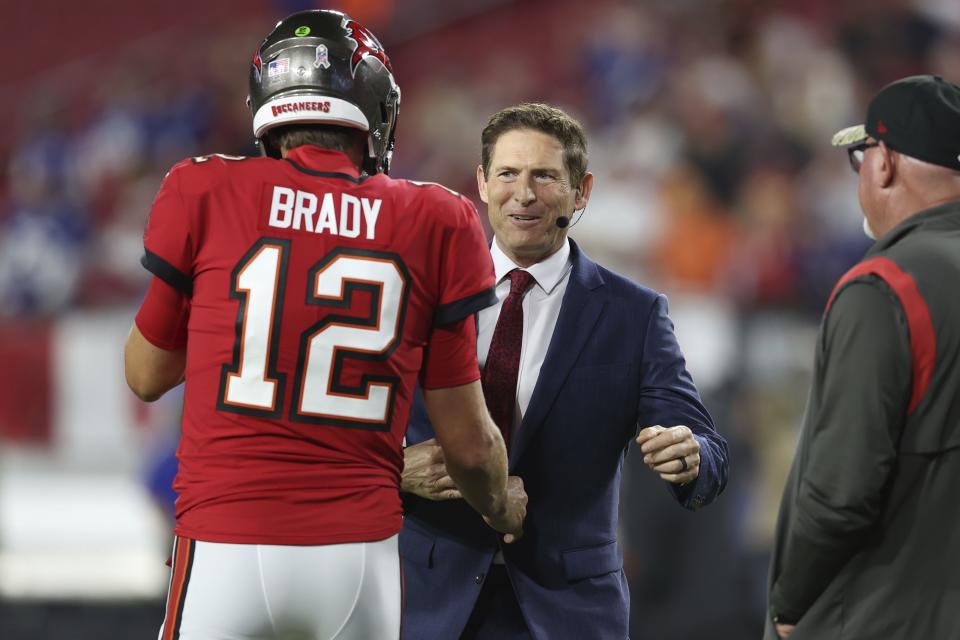 Former NFL quarterback Steve Young greets Tampa Bay Buccaneers quarterback Tom Brady (12) before game against the New York Giants Monday, Nov. 22, 2021, in Tampa, Fla. | Mark LoMoglio, Associated Press