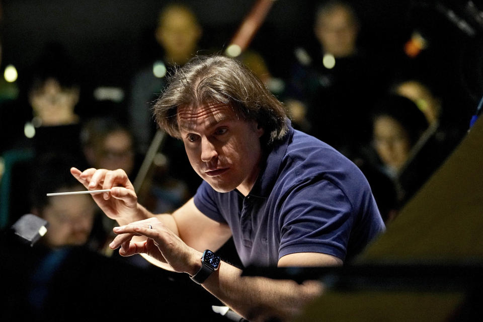 Guest Conductor Gavriel Heine leads Ballet Arizona musicians in a rehearsal for the "Nutcracker", Thursday, Dec. 7, 2023, in Phoenix prior to an upcoming performance. A pit full of musicians is part of the tradition of the holiday staple for Ballet Arizona and many other productions around the world. Shows use recordings as they weather costs or crises like recessions. But fans, musicians and the unions that represent them say the live music brings an unseen signature to each show. (AP Photo/Matt York)