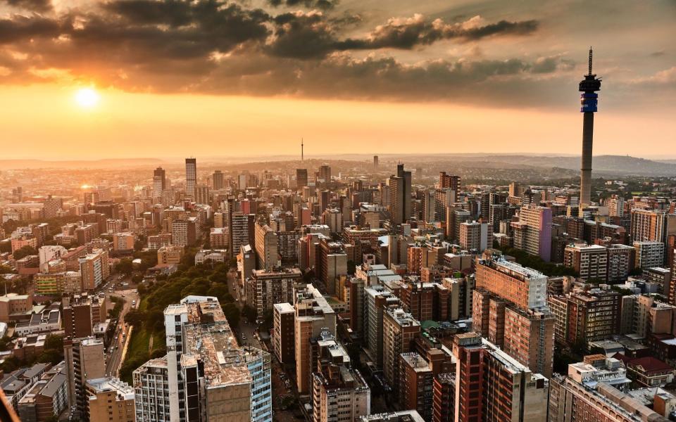 The Telkom Tower, right, surrounded by residential tower blocks and commercial offices, viewed from the Ponte City Apartments building, in the Berea district of Johannesburg, South Africa - Waldo Swiegers/Bloomberg