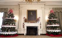 The State Dining Room includes gingerbread men and trees lined with 56Lego homes.