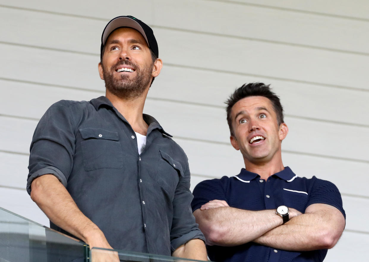 Wrexham owners Ryan Reynolds (left) and Rob McElhenney during the Vanarama National League semi-final match at The Racecourse Ground, Wrexham. Picture date: Saturday May 28, 2022. (Photo by Bradley Collyer/PA Images via Getty Images)