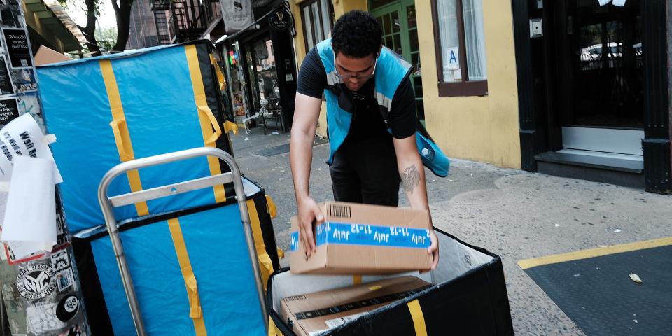 An Amazon worker moves boxes on Amazon Prime Day on July 11, 2023 in the East Village of New York City. Amazon holds the annual two-day event, where it offers shopping deals to Prime customers, in the middle of the summer. Amazon Prime Day has brought an estimated 10 billion dollars to the company in each of the last 3 years, as customers look to take advantage of discounts and quick shipping. (Photo by )