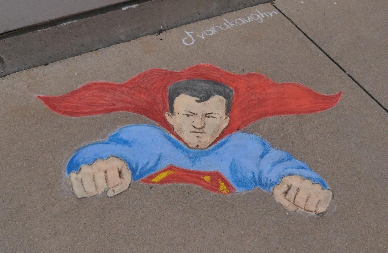 Hutchinson artist Kara Vaughn drew this chalk drawing of Superman outdoors as part of a festival held each June in which Hutchinson is known for a day as "Smallville."