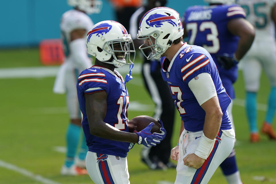 Buffalo Bills quarterback Josh Allen (17) congratulates wide receiver John Brown (15) after Brown scored a touchdown, during the second half of an NFL football game against the Miami Dolphins, Sunday, Sept. 20, 2020, in Miami Gardens, Fla. The Bills defeated the Dolphins 31-28. (AP Photo/Lynne Sladky)