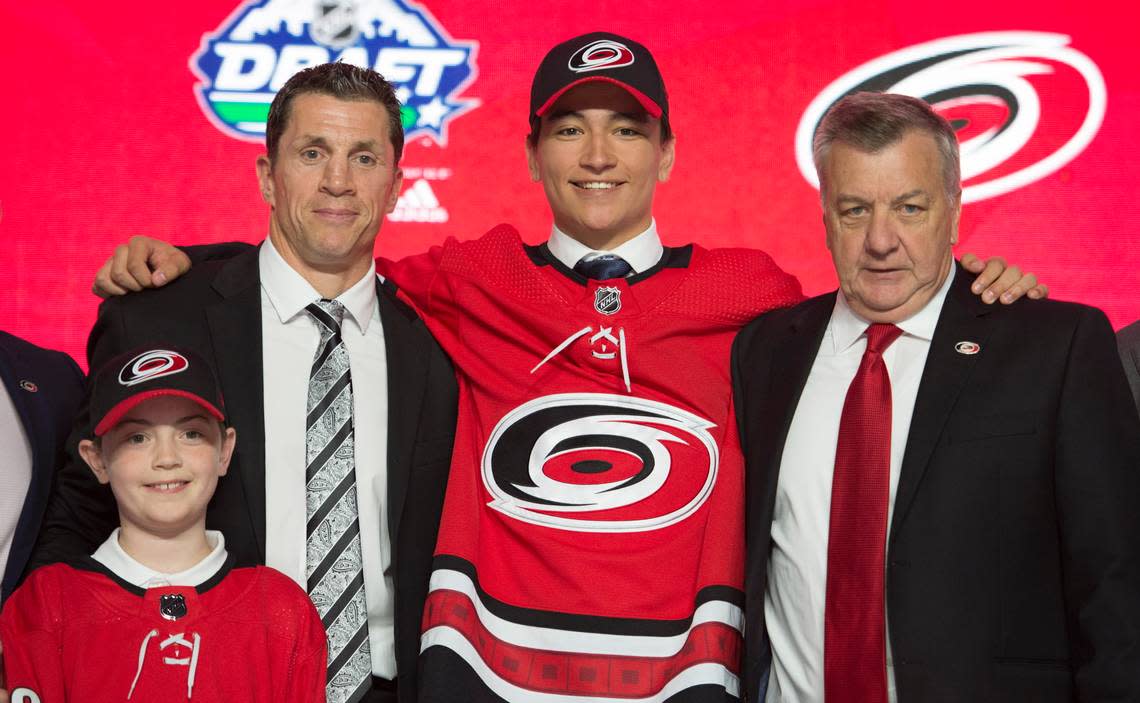 Ryan Suzuki smiles while wearing a Carolina Hurricanes jersey during the first round of the NHL hockey draft Friday, June 21, 2019, in Vancouver, British Columbia. JONATHAN HAYWARD/AP