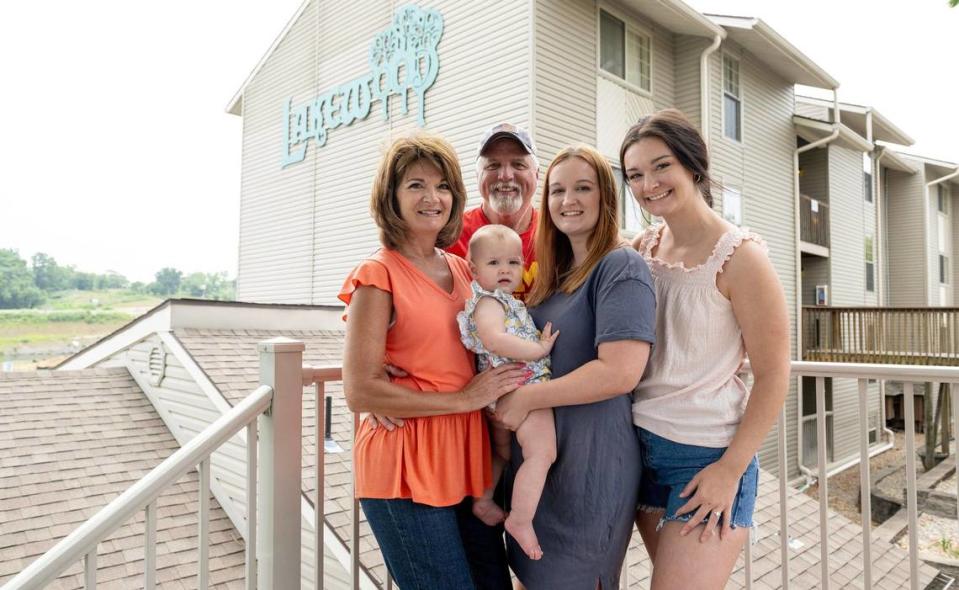 Paula Daube, her partner Roger Gettings, Erika Daube, far right, Miranda Warnick and her daughter Sutton pose for a photo outside of their condo at Lakewood Resort.