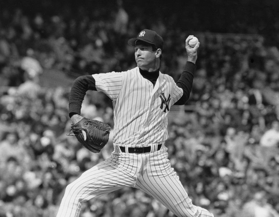 New York Yankee's pitcher Tommy John is shown in action on the mound in 1979.