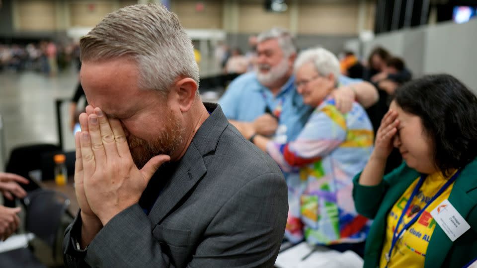Rev. Andy Oliver reacts after the United Methodist Church removes a rule forbidding "self-avowed practicing homosexuals" from being ordained or appointed as ministers. - Chris Carlson/AP