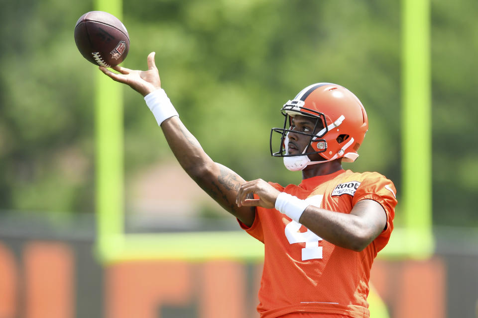 Cleveland Browns quarterback Deshaun Watson throws a pass during the NFL football team's training camp, Monday, August 1, 2022, in Berea, Ohio. Watson was suspended for six games on Monday after being accused by two dozen women in Texas of sexual misconduct during massage treatments, in what a disciplinary officer said was behavior “more egregious than any before reviewed by the NFL.” (AP Photo/Nick Cammett)