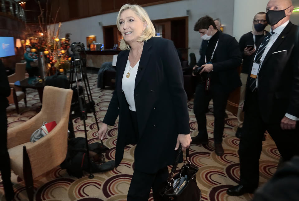 The French far-right party leader Marine Le Pen walks to hold a briefing with reporters in Warsaw, Poland, Saturday, Dec. 4, 2021. The leaders of right-wing populist parties met to discuss how they can work together to bring change to the European Union, which they accuse of acting like a super-state that is eroding the traditions and powers of the EU's 27 member nations. (AP Photo)