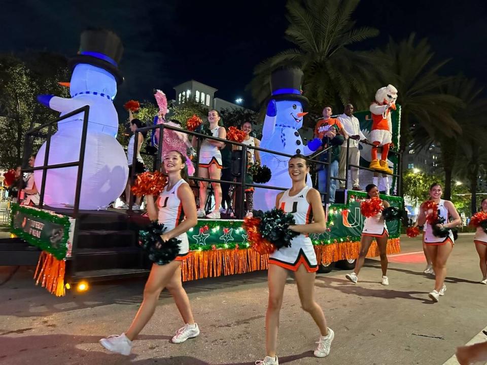 University of Miami cheerleaders and Sebastian the Ibis (doing double duty as the UM’s mascot rode in a convertible just an hour or so earlier on the Miracle Mile parade route of the 75th Annual Junior Orange Bowl Parade in Coral Gables on Dec. 10, 2023.