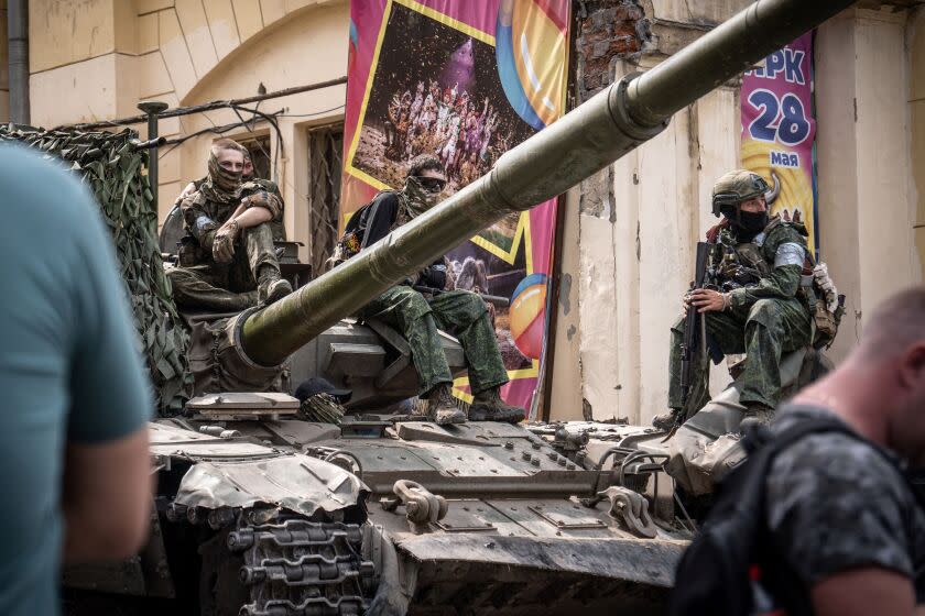 Members of Wagner group sit atop of a tank in a street in the city of Rostov-on-Don, on June 24, 2023. President Vladimir Putin on June 24, 2023 said an armed mutiny by Wagner mercenaries was a "stab in the back" and that the group's chief Yevgeny Prigozhin had betrayed Russia, as he vowed to punish the dissidents. Prigozhin said his fighters control key military sites in the southern city of Rostov-on-Don. (Photo by Roman ROMOKHOV / AFP) (Photo by ROMAN ROMOKHOV/AFP via Getty Images)