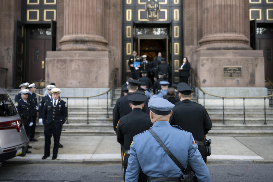 Law enforcement officers gather for a funeral service for officer Richard Mendez at the Cathedral Basilica of Saints Peter and Paul in Philadelphia, Tuesday, Oct. 24, 2023. Mendez was shot and killed, and a second officer was wounded when they confronted people breaking into a car at Philadelphia International Airport, Oct. 12, police said. (AP Photo/Joe Lamberti)