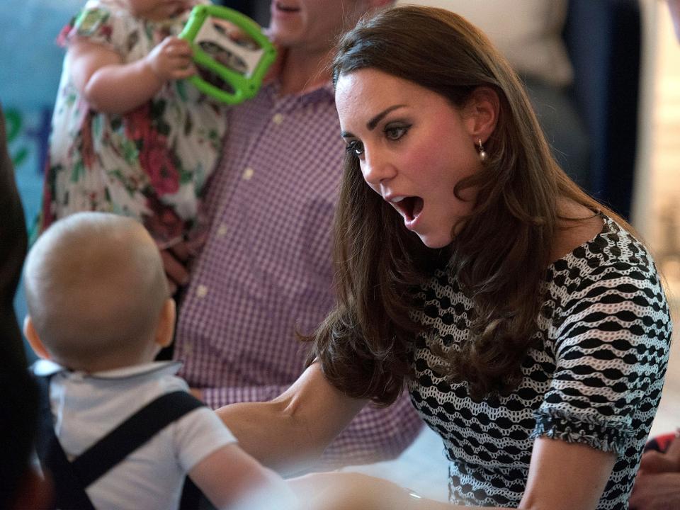 Kate Middleton plays with Prince George in 2014.