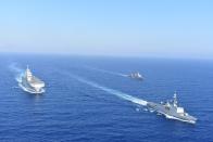 Greek and French vessels sail in formation during a joint military exercise in Mediterranean sea