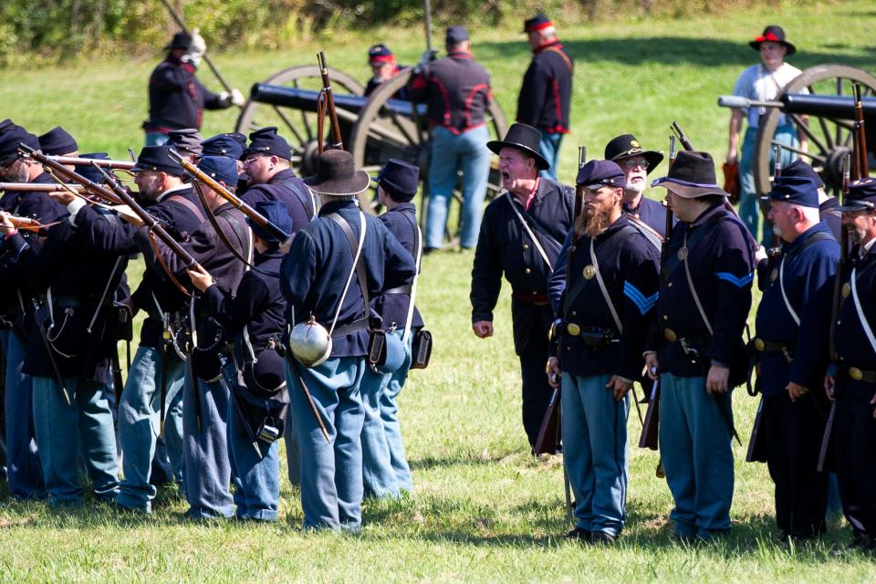 Union soldiers take orders from their commanders during a reenactment of the Battle of Antietam on Saturday, Sept. 17, 2022, at Van Raalte Farm Park in Holland.