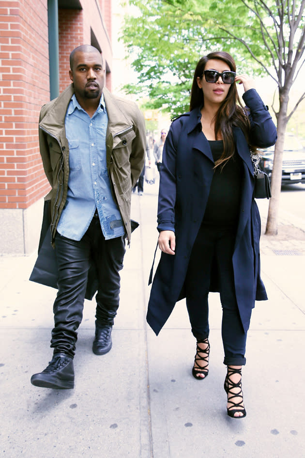 Kim Kardashian stuck to black and teamed her casual look with heels and a navy coat. Copyright [Splash]