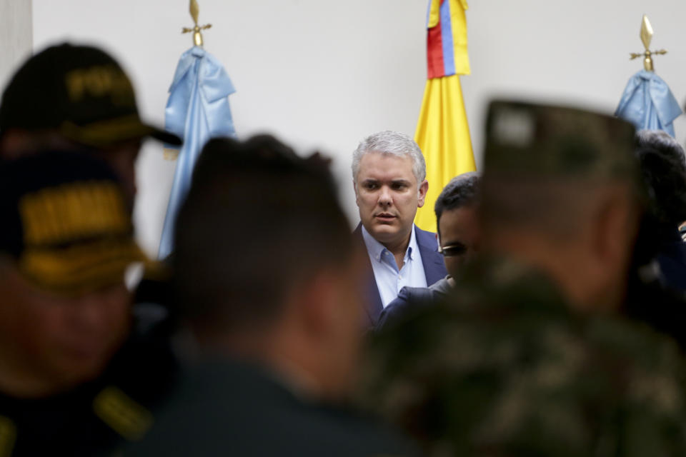 Colombia's President Ivan Duque arrives to speak to journalists before departing to attend the U.N. General Assembly from the CATAM air base in Bogota, Colombia, Saturday, Sept. 21, 2019. (AP Photo/Ivan Valencia)