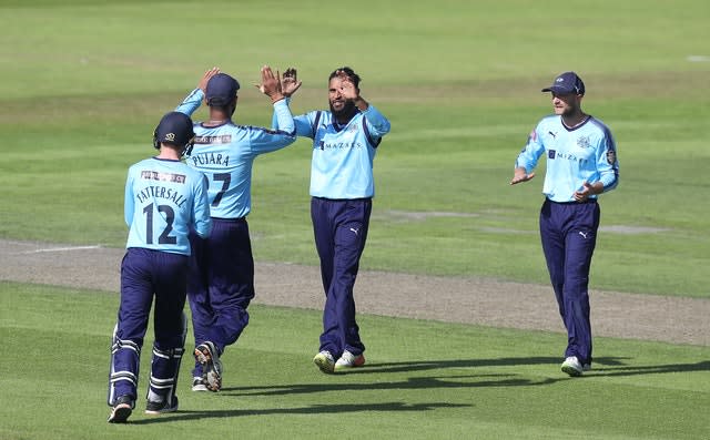 Rashid, centre, has taken 110 T20 wickets for Yorkshire (Martin Rickett/PA)