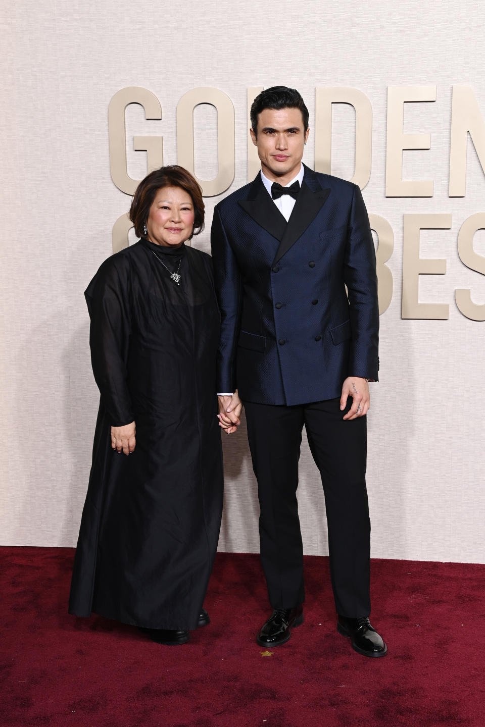 Charles Melton brought his mother, Sukyong Melton, to the 2024 Golden Globes. (Photo by Jon Kopaloff/WireImage,)