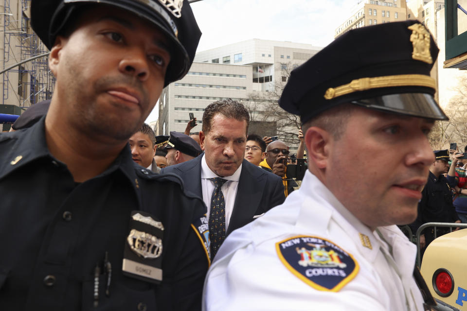 Joseph Tacopina, center, defense attorney for former President Donald Trump, leaves Manhattan criminal court, Tuesday, April 4, 2023, in New York. Trump appeared in a New York City courtroom on charges related to falsifying business records in a hush money investigation, the first president ever to be charged with a crime. (AP Photo/Yuki Iwamura)