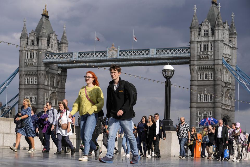 People queue at the start of the more than four miles long line, near Tower Bridge, to pay their respect to the late Queen Elizabeth II during the Lying-in State, in Westminster Hall in London, Thursday, Sept. 15, 2022. The Queen will lie in state in Westminster Hall for four full days before her funeral on Monday Sept. 19. (AP Photo/Martin Meissner)