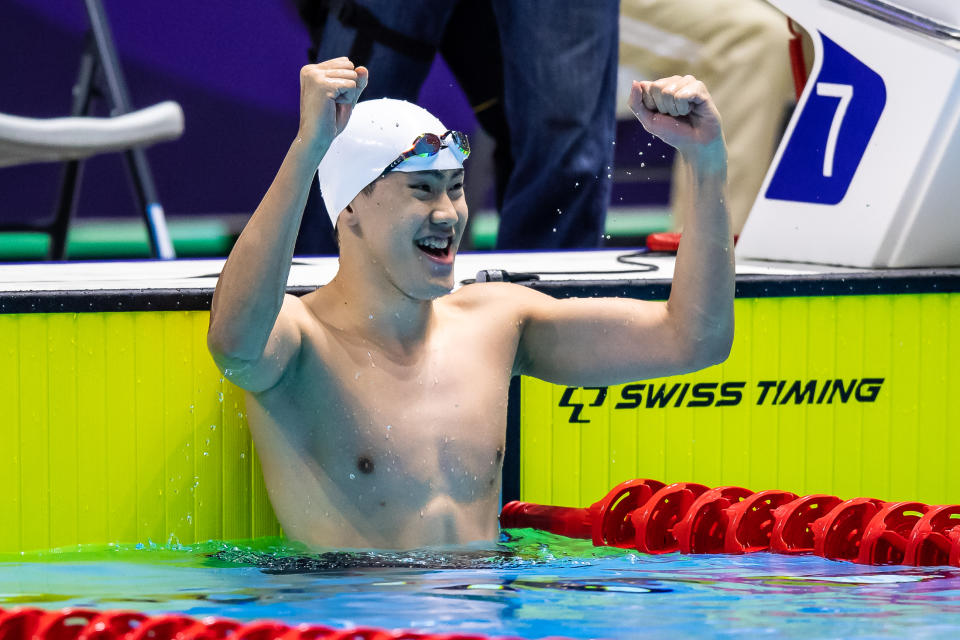 Singapore swimmer Darren Chua celebrates winning the SEA Games gold in the men's 100m freestyle over Joseph Schooling. (PHOTO: SNOC/Andy Chua)