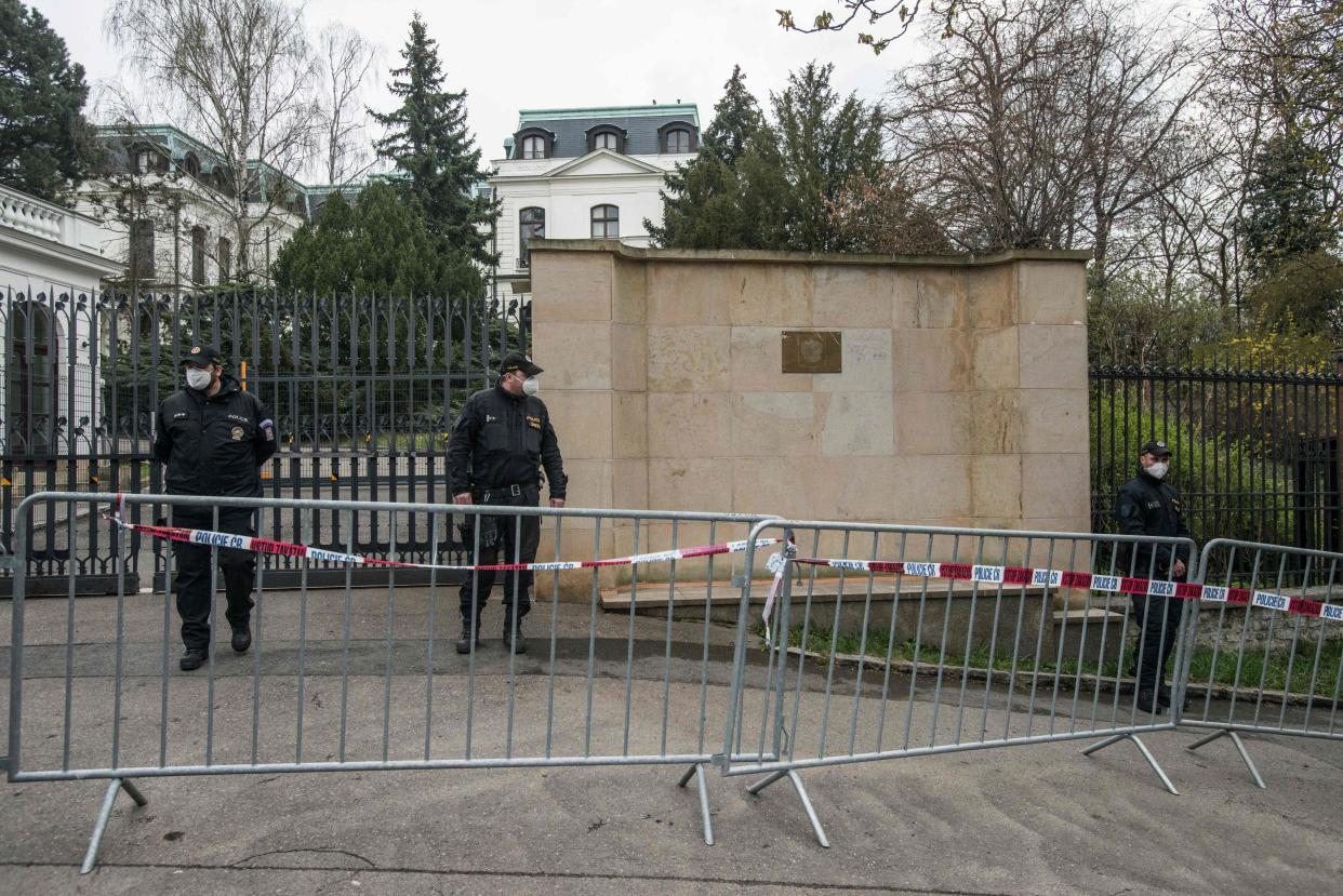 <p>Police officers form a cordon as protesters gather in front of the Russian Embassy on 18 April, 2021 in Prague.</p> (AFP via Getty Images)