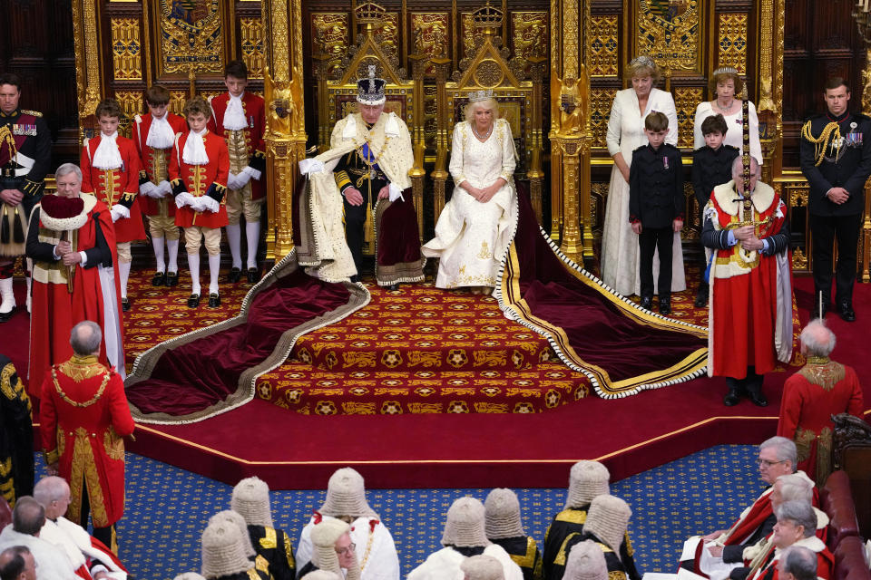 FILE - Britain's King Charles III sits besides Queen Camilla during the State Opening of Parliament at the Palace of Westminster in London, Tuesday, Nov. 7, 2023. At an age when many of his contemporaries have long since retired, King Charles III is not one to put his feet up. The king will mark his 75th birthday on Tuesday, Nov. 14, 2023, by highlighting causes close to his heart. With Queen Camilla at his side, Charles will visit a project that helps feed those in need by redistributing food that might otherwise go to landfills. (AP Photo/Kirsty Wigglesworth, Pool, File)