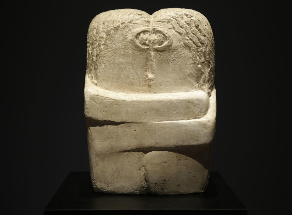 "Le Baiser" by Constantin Brancusi is displayed during an auction preview at Christie's in New York, Tuesday, May 6, 2014. Works from the estates of heiress Huguette Clark, Edgar Bronfman and other major collectors are leading New York City’s spring art auctions. The sale of impressionist and modern art begins Tuesday evening at Christie’s. The auction house says it expects to raise over $245 million. (AP Photo/Seth Wenig)