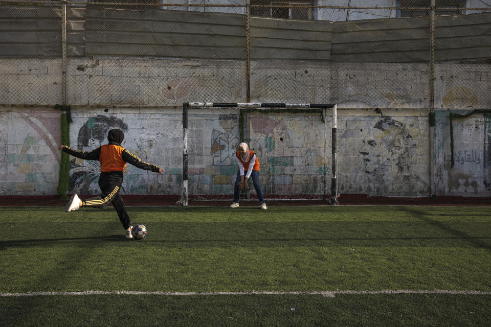 Palestinian girls practice during a soccer training session at the Beit Hanoun Al-Ahli Youth Club's ground in the northern Gaza strip, Tuesday, Oct. 29, 2022. Women's soccer has been long been neglected in the Middle East, a region that is mad for the men's game and hosts the World Cup for the first time this month in Qatar. (AP Photo/Fatima Shbair)