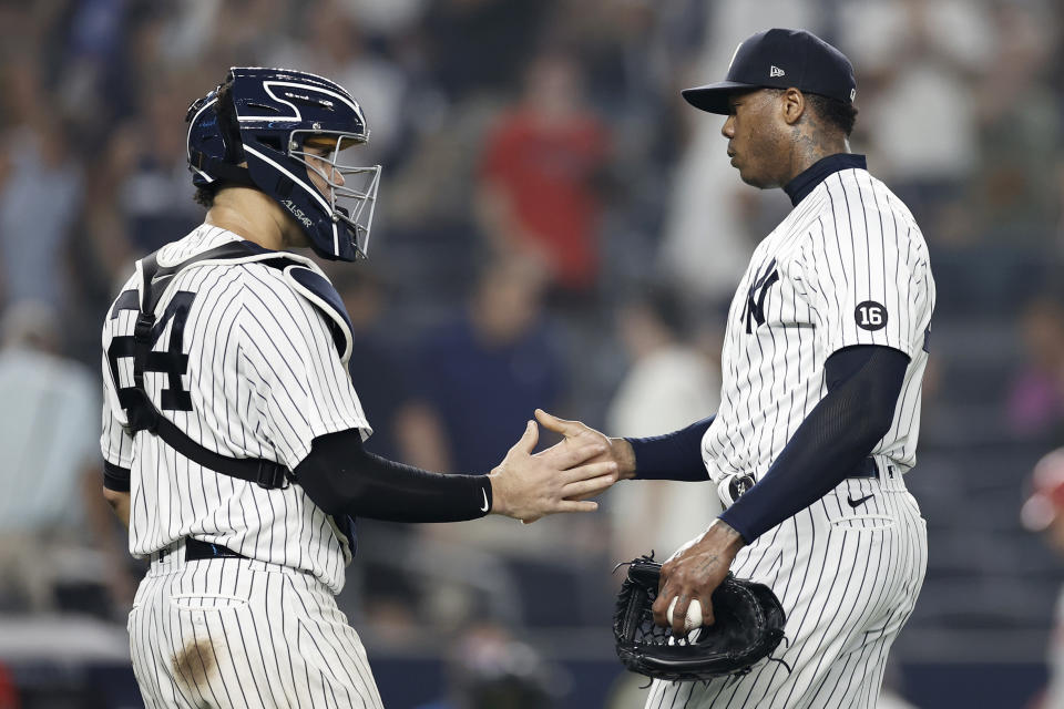 New York Yankees pitcher Aroldis Chapman celebrates with catcher Gary Sanchez (24) after the Yankees defeated the Philadelphia Phillies 6-4 in a baseball game Tuesday, July 20, 2021, in New York. (AP Photo/Adam Hunger)