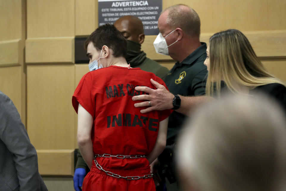Parkland school shooter Nikolas Cruz is escorted from the courtroom following a pre-trial hearing at the Broward County Courthouse in Fort Lauderdale, Fla., Wednesday, July 14, 2021, on four criminal counts stemming from his alleged attack on a Broward jail guard in November 2018. Cruz is accused of punching Sgt. Ray Beltran, wrestling him to the ground and taking his stun gun. (Amy Beth Bennett/South Florida Sun-Sentinel via AP, Pool)