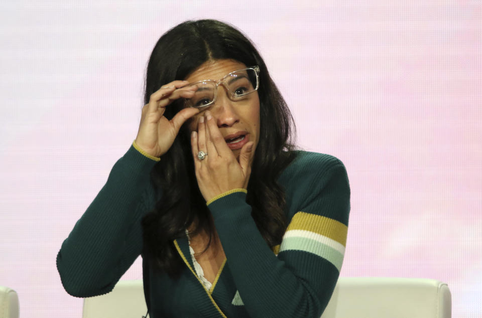CORRECTS NETWORK FROM SHOWTIME TO CW - Gina Rodriguez wipes away a tear as she speaks in the A Final Farewell to "Jane the Virgin" panel during the Showtime TCA Winter Press Tour on Thursday, Jan. 31, 2019, in Pasadena, Calif. (Photo by Willy Sanjuan/Invision/AP)