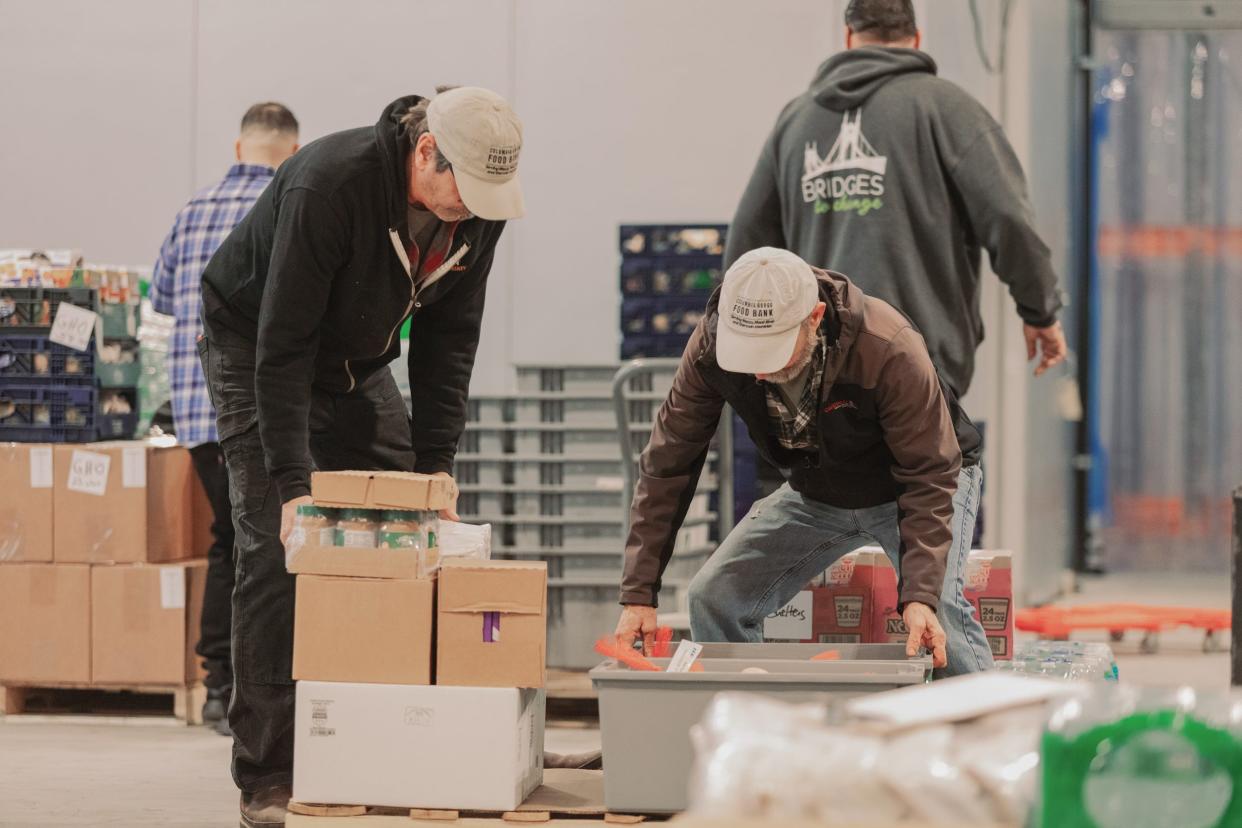 Jars of peanut butter and other food items are unloaded at Oregon Food Bank.