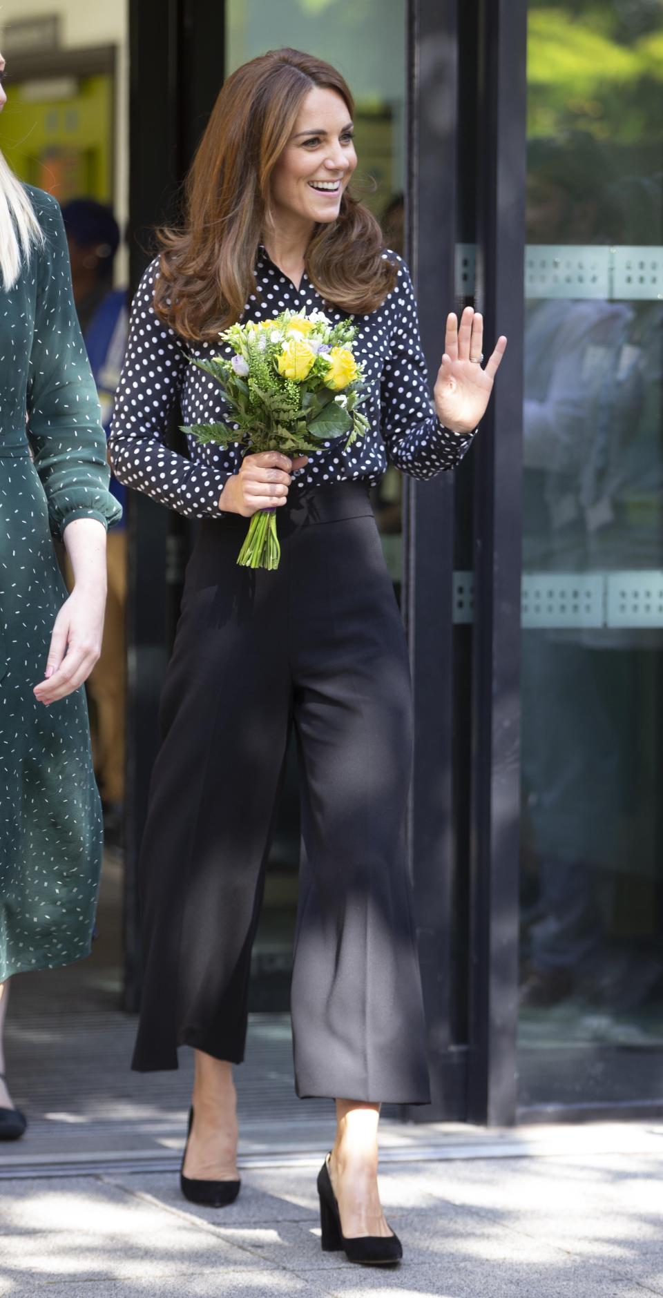 Kate Middleton opted for a £30 pair of black culottes from Zara. [Photo: Getty Images]